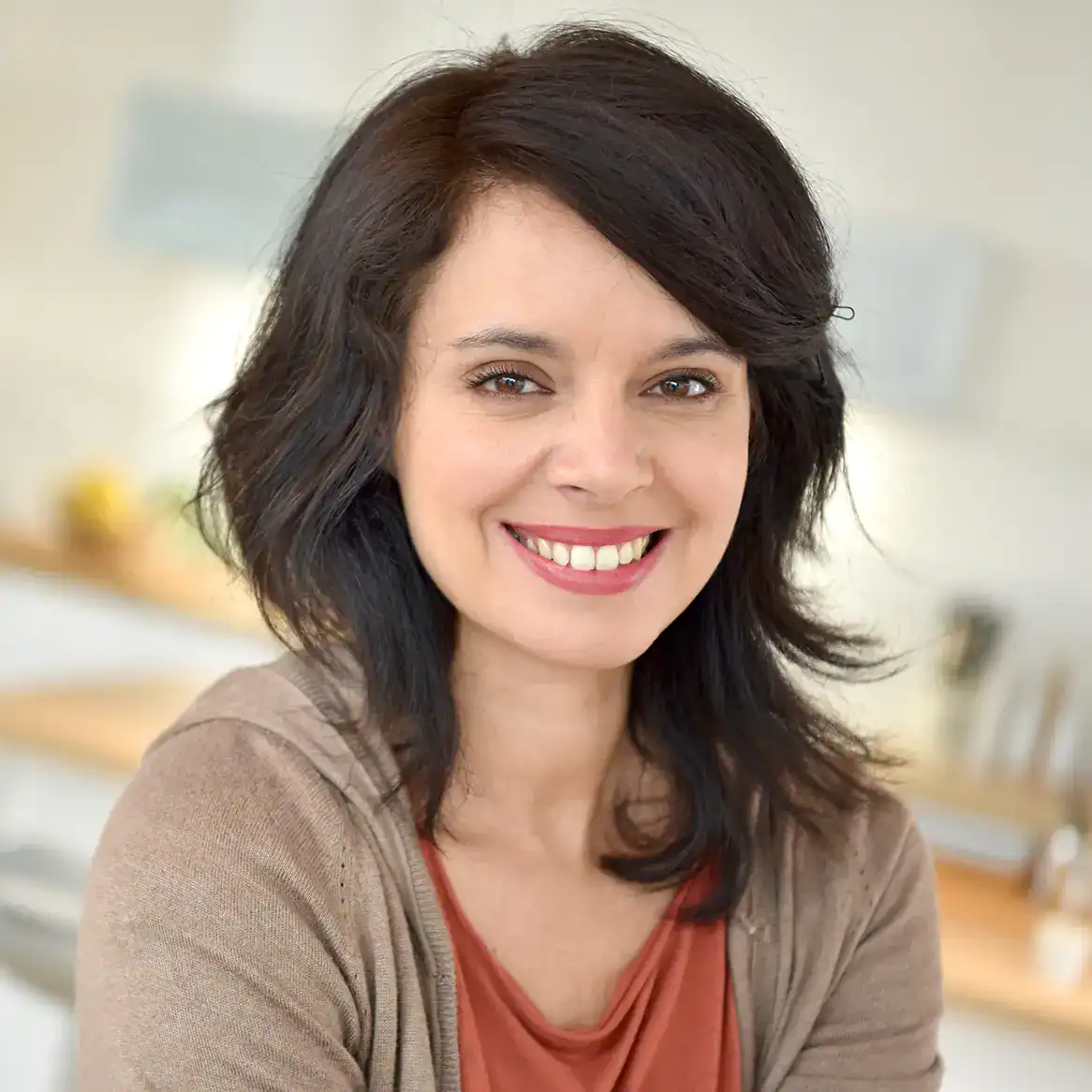 A woman smiling after Infini RF Microneedling.